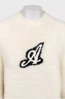 Beige sweater with a patch