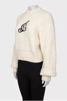 Beige sweater with a patch