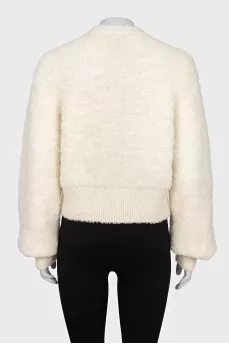 Beige sweater with a patch