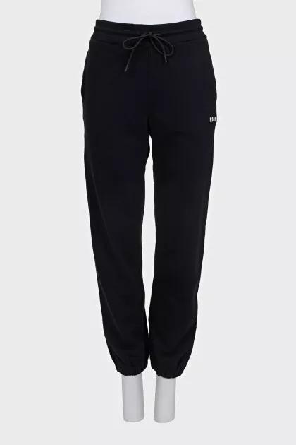 Sports pants with a white logo