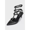 Rockstud black leather slingbacks
