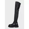 Black leather over-the-knee boots with a round toe