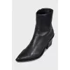 Black leather Cossack boots with a stacked heel