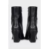 Black leather Cossack boots with a stacked heel