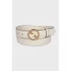 Narrow belt with a gold buckle