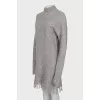 Oversized dress decorated with fringe