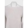 Knitted white dress with long sleeves