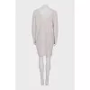 Knitted white dress with long sleeves