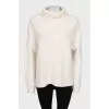 White turtleneck sweater
