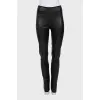 Black leather trousers with slits at the bottom