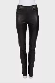 Black leather trousers with slits at the bottom