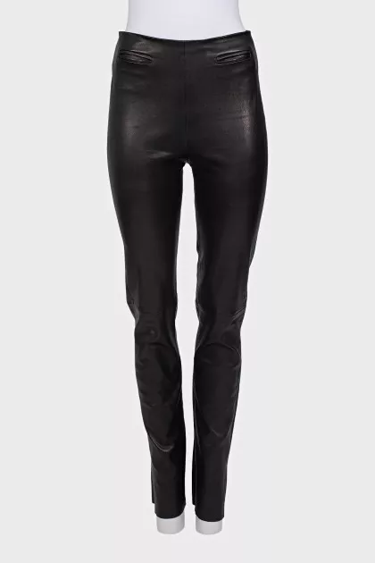 Black leather trousers with slits at the bottom