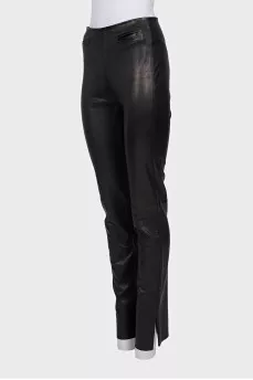 Black leather trousers with slits at the bottom