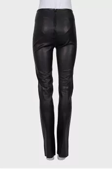 Black leather trousers with slits at the bottom