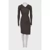 A fitted dress decorated with drapery