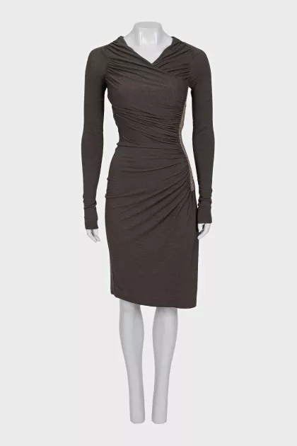 A fitted dress decorated with drapery