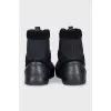 Black sneakers with suede inserts and a removable sole