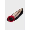 Patent leather ballet flats decorated with a flower