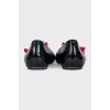 Patent leather ballet flats decorated with a flower