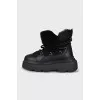 Insulated black boots with a massive sole