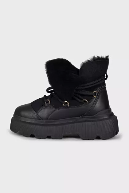 Insulated black boots with a massive sole