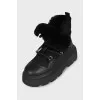 Insulated black boots with a massive sole