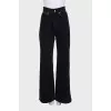 Wide-leg black jeans with gold hardware