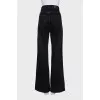 Wide-leg black jeans with gold hardware