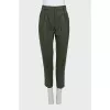Green tapered trousers with creases