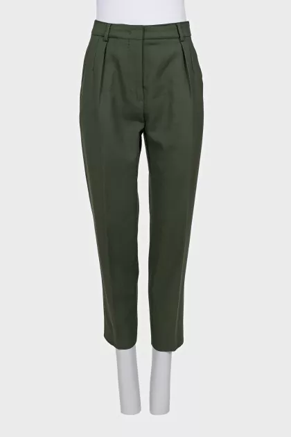 Green tapered trousers with creases