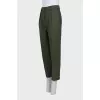 Green tapered trousers with creases