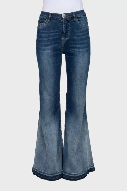 Flared jeans with buttons on the legs