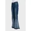Flared jeans with buttons on the legs
