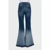 Flared jeans with buttons on the legs