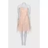 Beige cocktail dress with ruffles