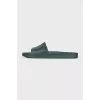 Green flip-flops with a metallic logo