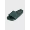 Green flip-flops with a metallic logo