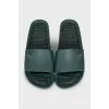 Green flip-flops with a metallic logo