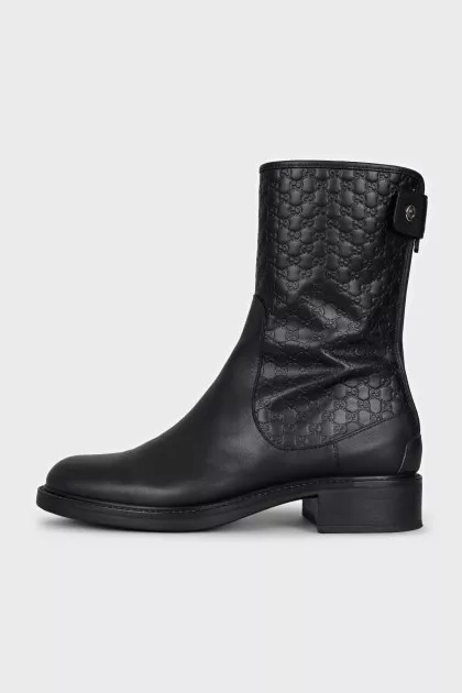 Black boots with branded embossing