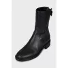 Black boots with branded embossing
