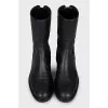 Black boots with branded embossing