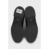Black boots with branded embossing
