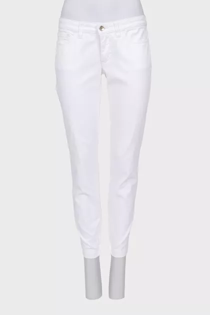 Tapered jeans with zippers at the bottom