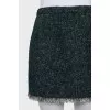 Mini skirt decorated with fringe