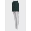 Mini skirt decorated with fringe