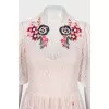 Beige dress decorated with embroidery