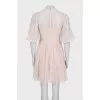 Beige dress decorated with embroidery