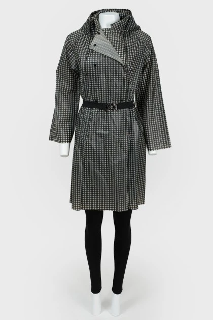 Raincoat on buttons with a handbag