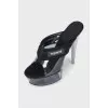 Black platform sandals with a combination of heels
