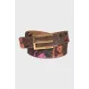 Printed belt with a gold buckle